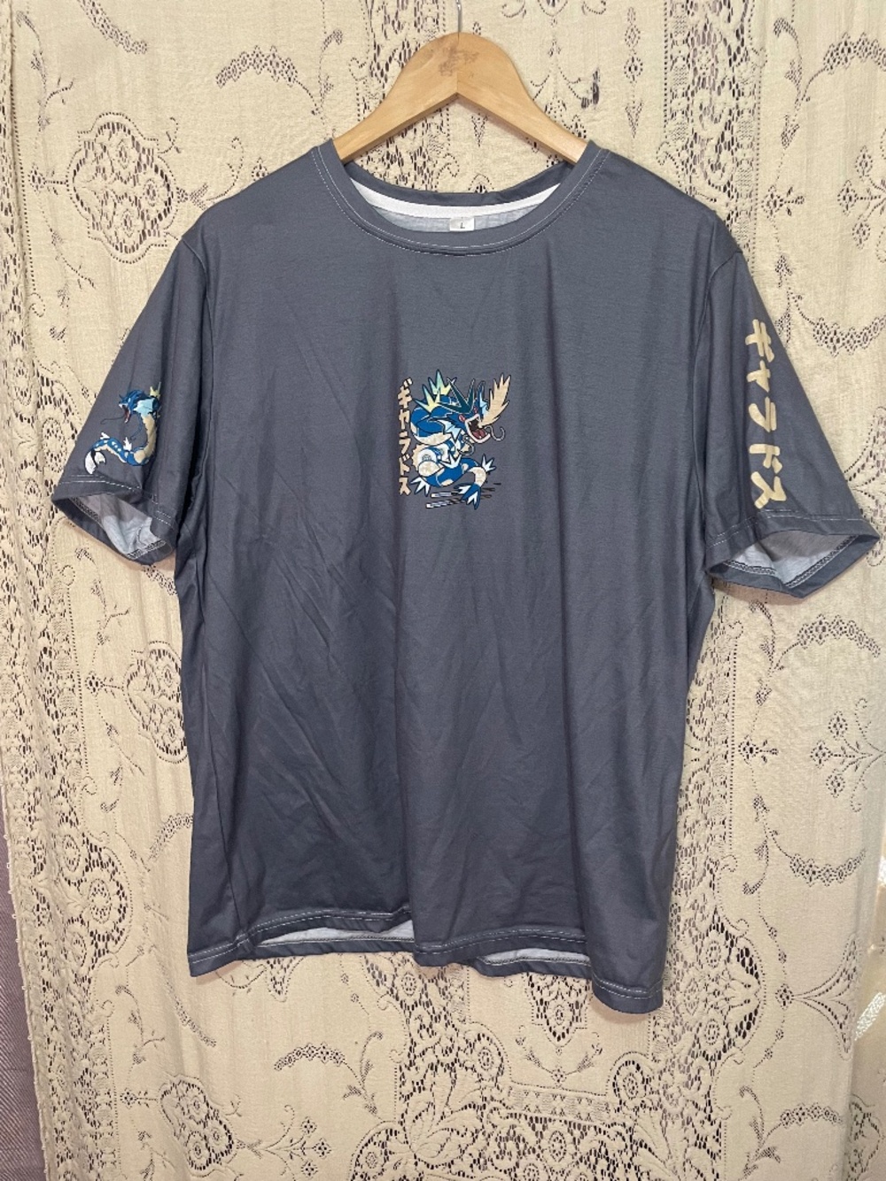 Pokemon Gyarados graphic t-shirt featuring Japanese characters and sleeve prints